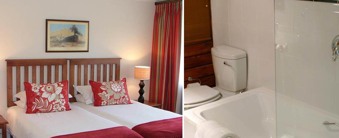 Seng og badevrelse p Graywood Hotel